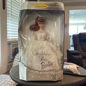 This is a collectable edition of Bride Barbie.